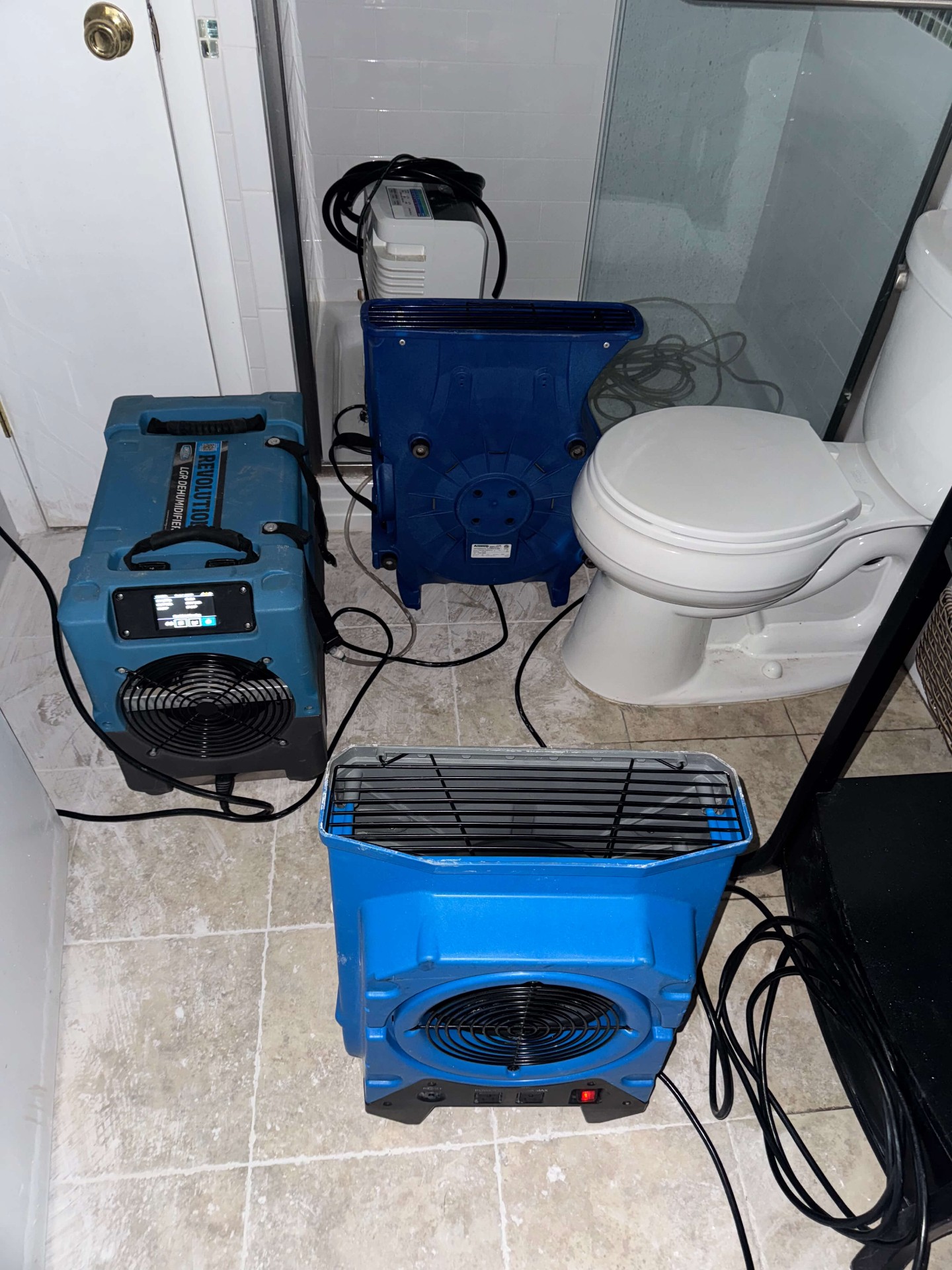 Professional structural drying equipment in bathroom - dehumidifiers and air movers in Fairfield County, CT